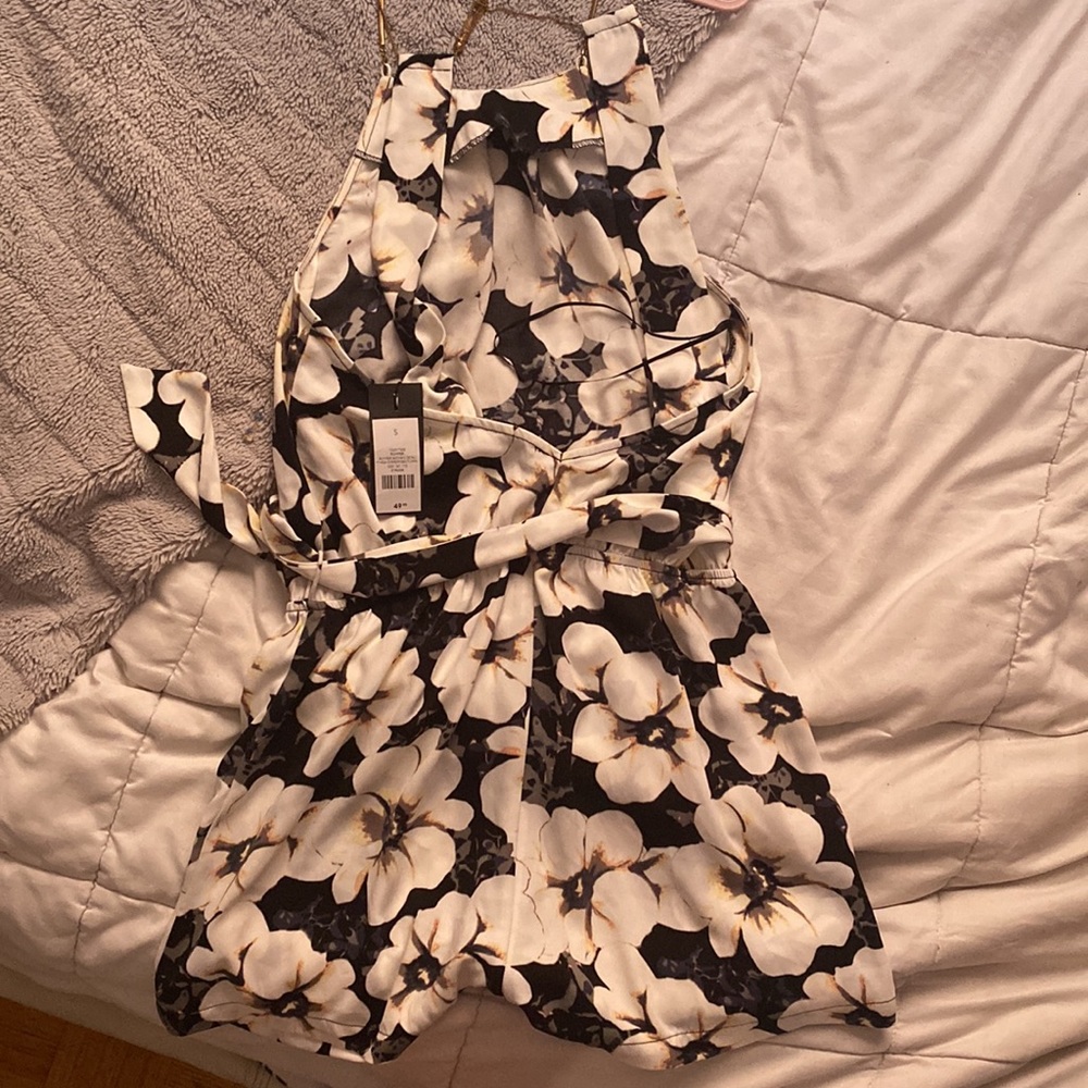 Flower romper. Shorts. Never worn.
